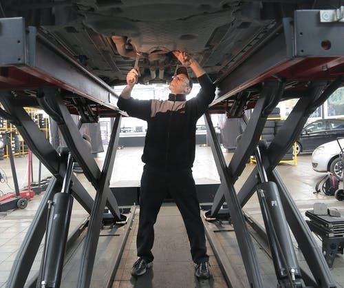 Tech working on car